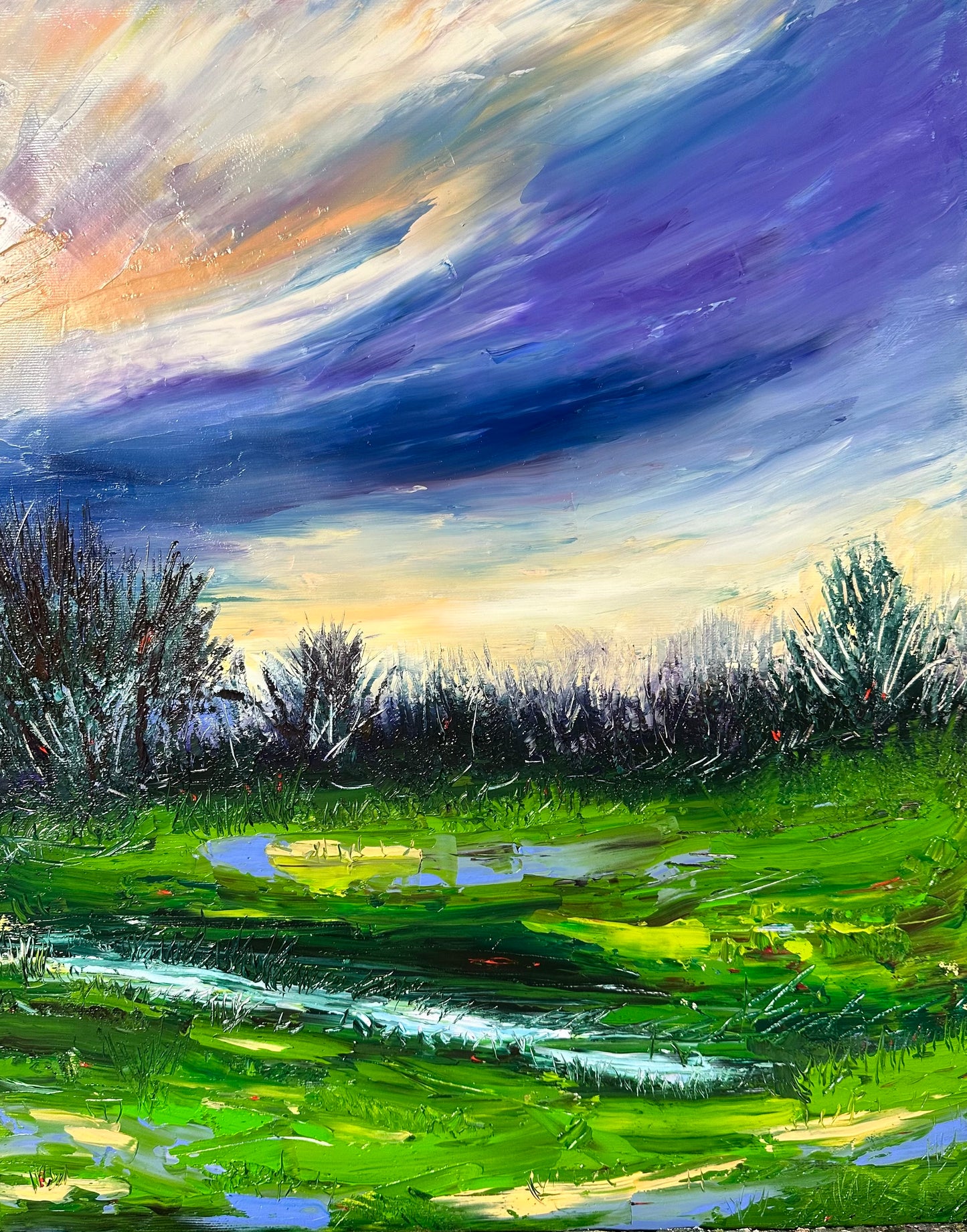 Abstract expressionism oil painting by Chelsea Tikotsky. This vibrant landscape captures a sweeping sunset over vast green fields & a serene water scene, beneath a bold, expansive sky. Rich greens blend with warm sunset hues of pink, orange, creating depth energy across the canvas. Expressive strokes add movement to the sky & fields, evoking tranquil yet powerful beauty of nature. Perfect for art collectors or a statement piece, this painting infuses spaces with warmth, color & refreshing open-sky feel