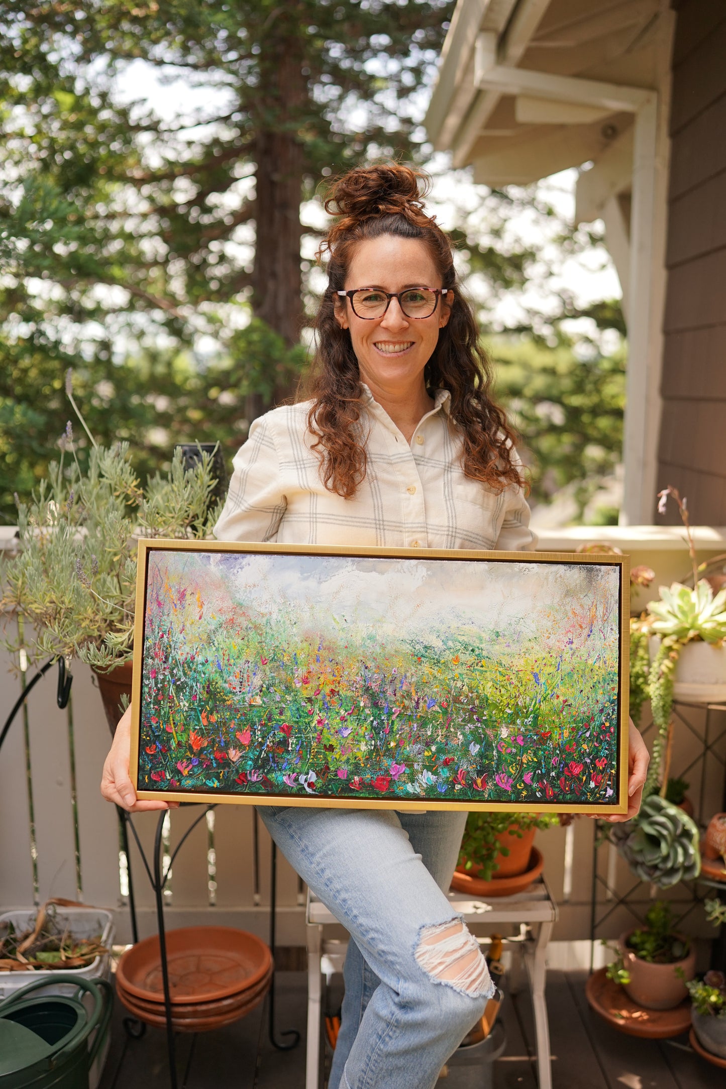Abstract expressionism oil painting of fields of flowers by artist Chelsea Tikotsky. This contemporary piece features loose, painterly strokes with soft & rich, bold colors, creating a romantic feel. Inspired by nature & floral landscapes, this piece offers texture, movement, & depth, perfect for home decor or art collectors seeking unique abstract art. Ideal for a living room or bedroom space, this statement piece brings warmth, elegance, & a refreshing botanical essence into any interior design.