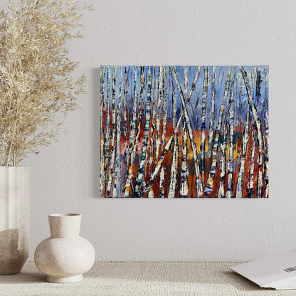 Abstract Birch Tree Oil Painting Art by artist Chelsea Tikotsky. Step into the vibrant beauty of nature with this original abstract oil painting of a birch tree forest. Featuring thick, textured strokes by palette knife, this artwork showcases striking white birch trees against a background of warm, fiery tones transitioning into cool blues. Perfect for art collectors, this abstract masterpiece radiates warmth & connection to the outdoors. Ideal statement piece for living rooms, offices, or cozy spaces.