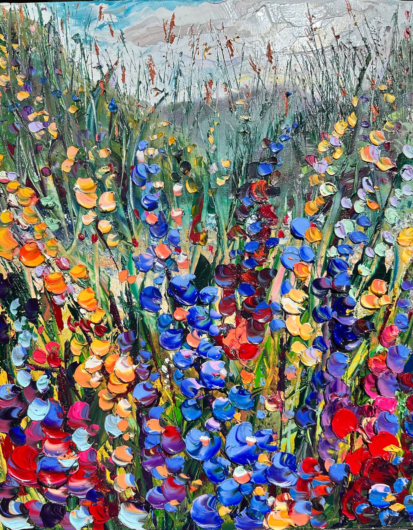 Abstract expressionism oil painting of fields of flowers by artist Chelsea Tikotsky. This contemporary piece features loose, painterly strokes with soft & rich, bold colors, creating a romantic feel. Inspired by nature & floral landscapes, this large piece offers texture, movement, & depth, perfect for home decor or art collectors seeking unique abstract art. Ideal for a living room or bedroom space, this statement piece brings warmth, elegance, & a refreshing botanical essence into any interior design.