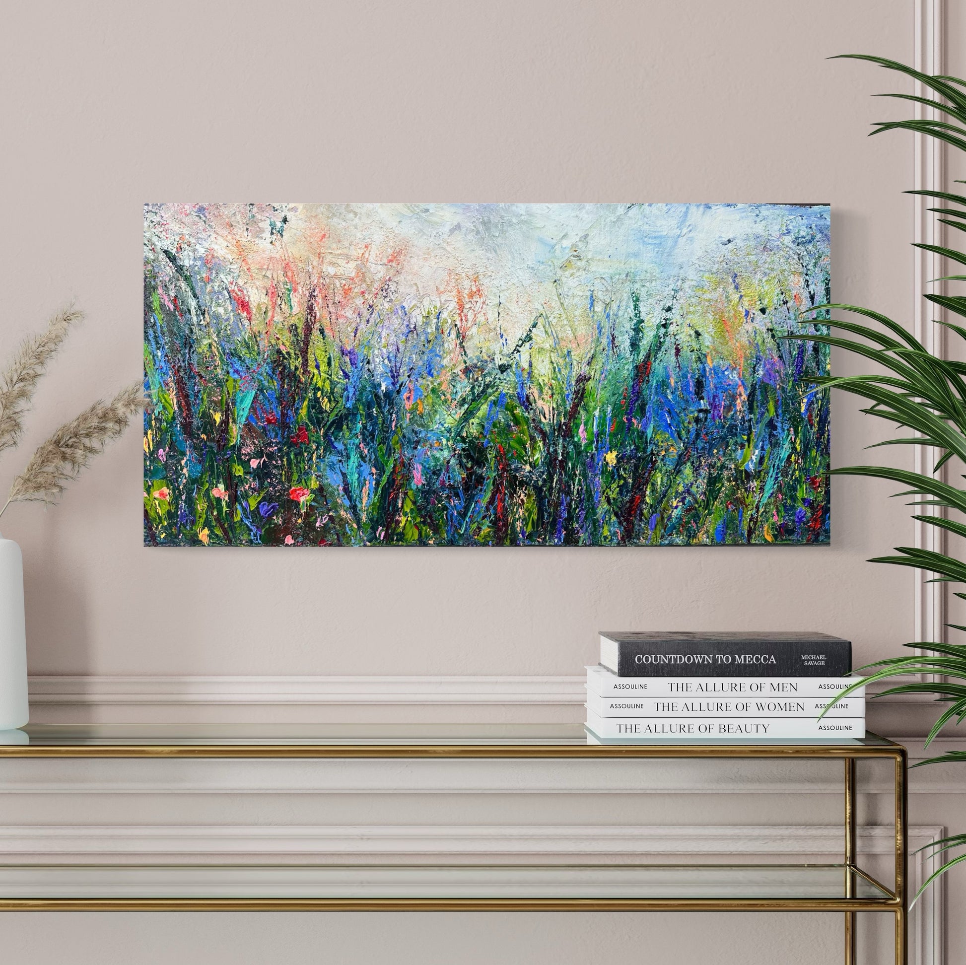 Abstract expressionism oil painting of fields of flowers by artist Chelsea Tikotsky. This contemporary piece features loose, painterly strokes with soft & rich, bold colors, creating a romantic feel. Inspired by nature & floral landscapes, this piece offers texture, movement, & depth, perfect for home decor or art collectors seeking unique abstract art. Ideal for a living room or bedroom space, this statement piece brings warmth, elegance, & a refreshing botanical essence into any interior design.