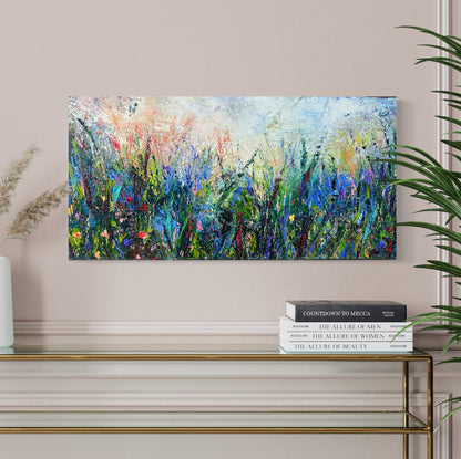 Abstract expressionism oil painting of fields of flowers by artist Chelsea Tikotsky. This contemporary piece features loose, painterly strokes with soft & rich, bold colors, creating a romantic feel. Inspired by nature & floral landscapes, this piece offers texture, movement, & depth, perfect for home decor or art collectors seeking unique abstract art. Ideal for a living room or bedroom space, this statement piece brings warmth, elegance, & a refreshing botanical essence into any interior design.