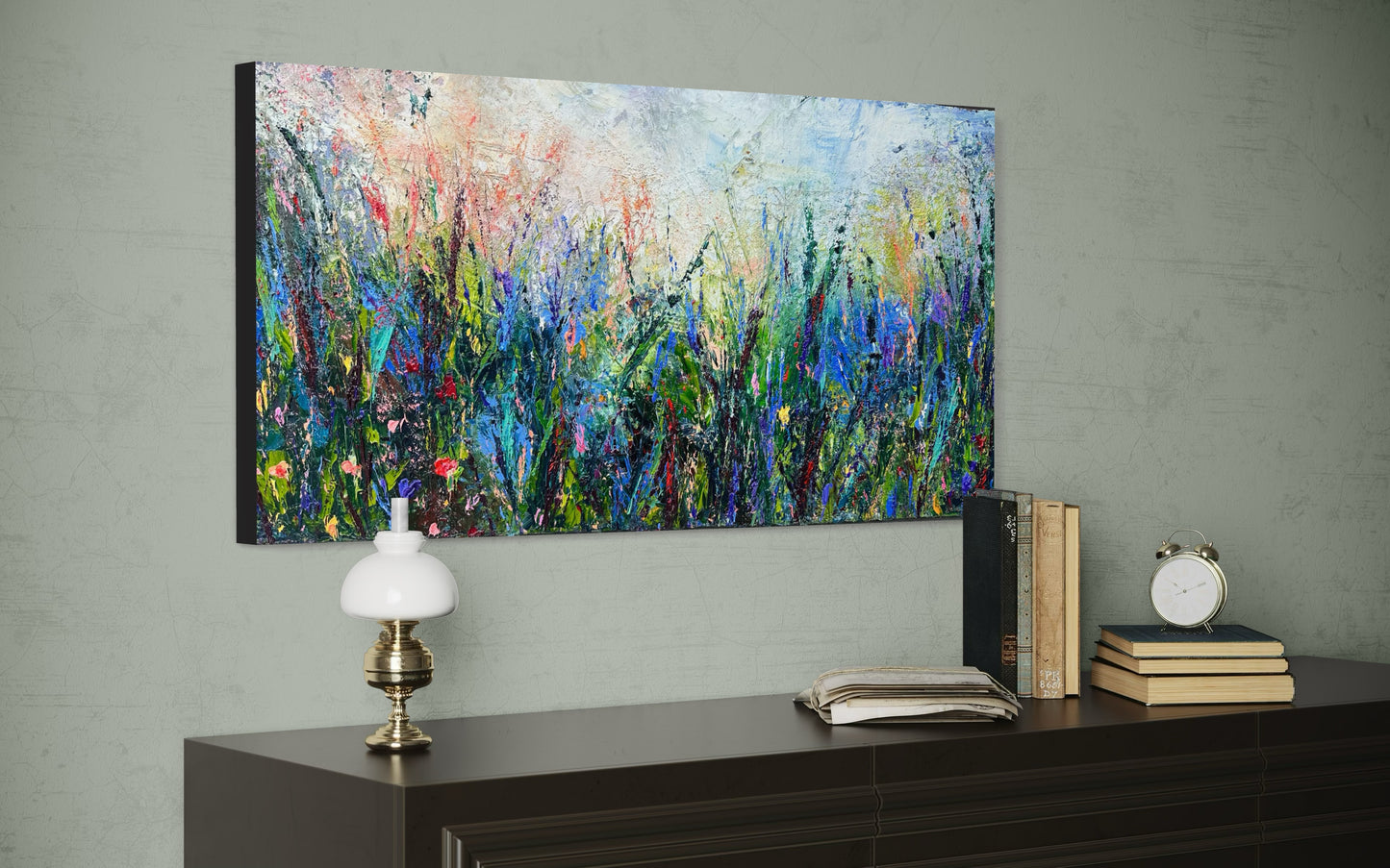 Abstract expressionism oil painting of fields of flowers by artist Chelsea Tikotsky. This contemporary piece features loose, painterly strokes with soft & rich, bold colors, creating a romantic feel. Inspired by nature & floral landscapes, this piece offers texture, movement, & depth, perfect for home decor or art collectors seeking unique abstract art. Ideal for a living room or bedroom space, this statement piece brings warmth, elegance, & a refreshing botanical essence into any interior design.