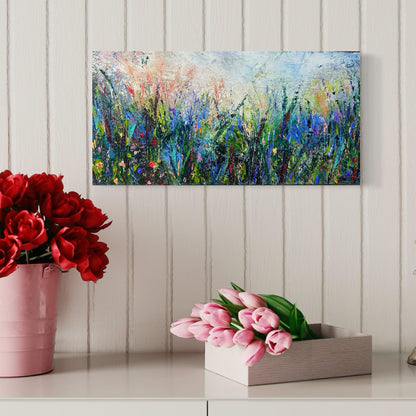 Abstract expressionism oil painting of fields of flowers by artist Chelsea Tikotsky. This contemporary piece features loose, painterly strokes with soft & rich, bold colors, creating a romantic feel. Inspired by nature & floral landscapes, this piece offers texture, movement, & depth, perfect for home decor or art collectors seeking unique abstract art. Ideal for a living room or bedroom space, this statement piece brings warmth, elegance, & a refreshing botanical essence into any interior design.