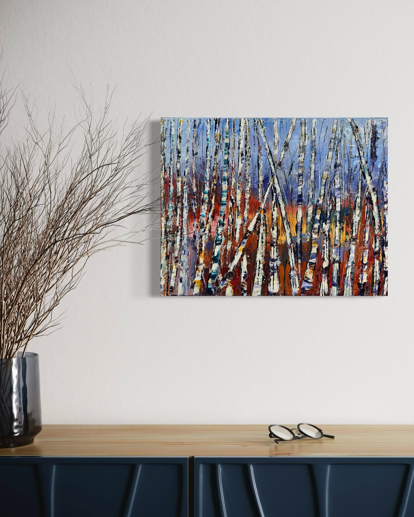 Abstract expressionism oil painting of small, colorful birch trees by artist Chelsea Tikotsky. This modern contemporary artwork features vibrant, painterly strokes with a blend of bold colors and soft pastels, capturing the essence of birch trees in a whimsical, impressionistic style. With rich texture and lively movement, this piece is perfect for art collectors or as a unique accent in home decor, adding warmth, charm, and a touch of nature-inspired color to any interior space.