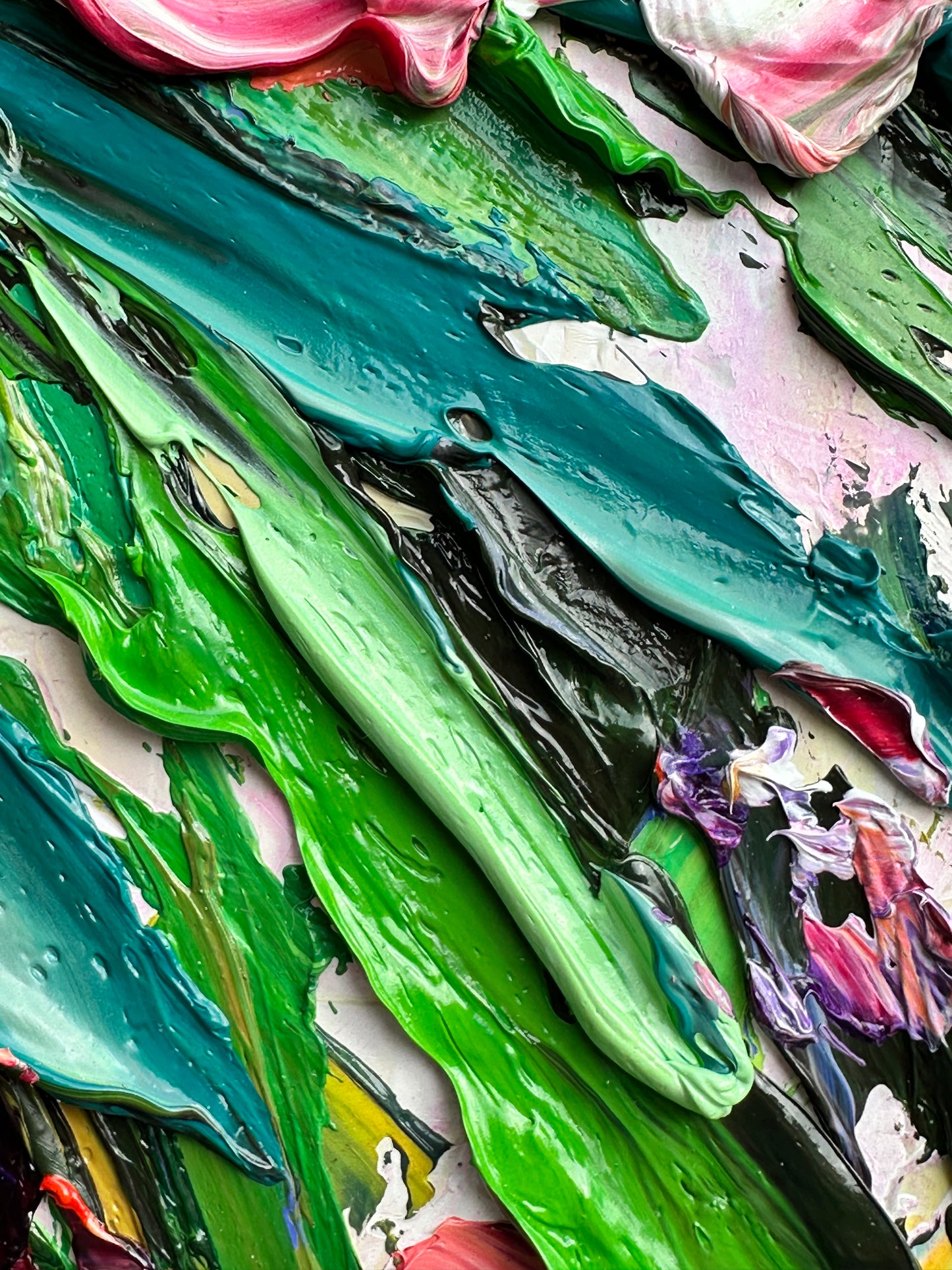 Close-up of colorful paint strokes on a textured surface
