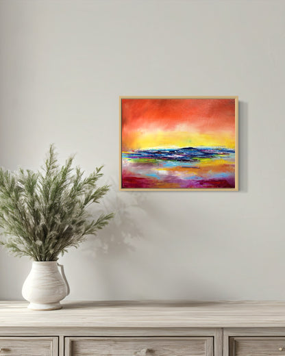 Abstract expressionism oil painting of a sunset reflecting on water, by artist Chelsea Tikotsky. This vibrant piece features bold reds, fiery yellows, and deep blues, with rich texture created through expressive brushstrokes and layering. The painting captures the dramatic glow of a setting sun as it reflects on the ocean, evoking warmth, movement, and serenity. Perfect for art collectors or as a striking accent in home decor, this textured sunset-inspired artwork adds energy and depth to any interior space